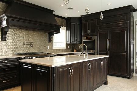 executive cabinetry with custom kitchen with black hood